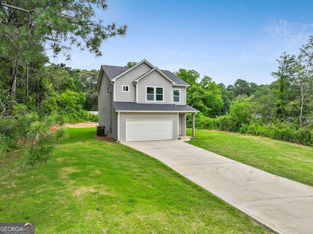 307 E Pine St E, Rockmart, GA 30153 - traditional home with an attached garage, concrete driveway, and a front yard