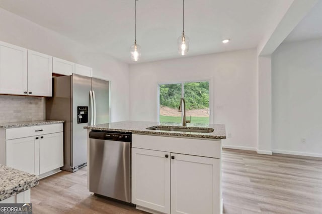 307 E Pine St E, Rockmart, GA 30153 - kitchen featuring appliances with stainless steel finishes, white cabinets, light wood-style floors, backsplash, and recessed lighting
