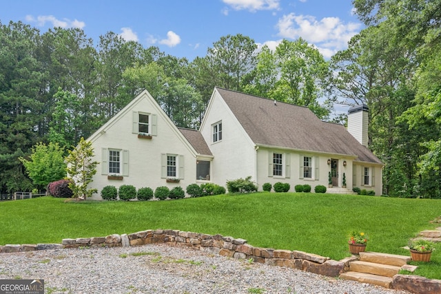5095 Karr Rd, Cumming, GA 30040 - cape cod home with a chimney, a front lawn, and roof with shingles