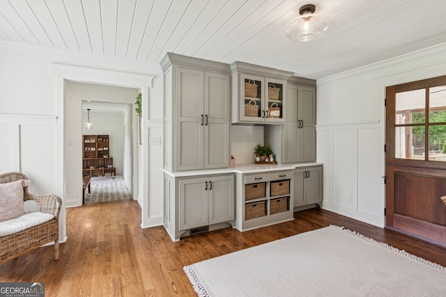 5095 Karr Rd, Cumming, GA 30040 - bar area with a decorative wall, crown molding, wood finished floors, wainscoting, and wood ceiling
