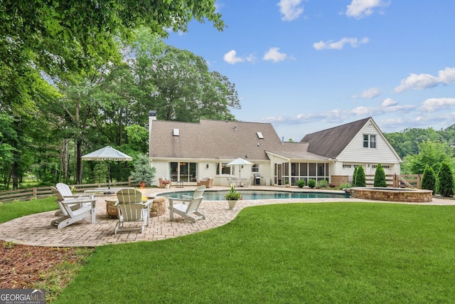 5095 Karr Rd, Cumming, GA 30040 - rear view of house with a sunroom, a fire pit, a patio, a chimney, and an outdoor pool
