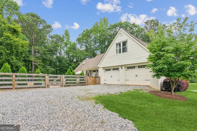 5095 Karr Rd, Cumming, GA 30040 - view of side of home with a garage, brick siding, and gravel driveway