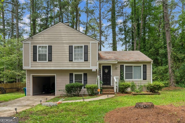 447 Sherwood Cir, Stone Mountain, GA 30087 - split level home featuring an attached garage and concrete driveway