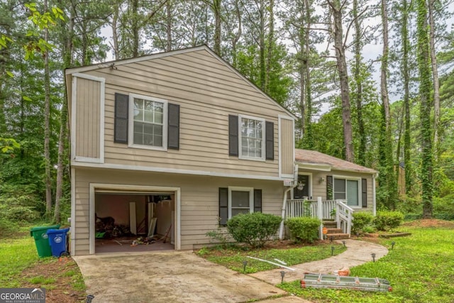 447 Sherwood Cir, Stone Mountain, GA 30087 - view of front of house featuring an attached garage and driveway