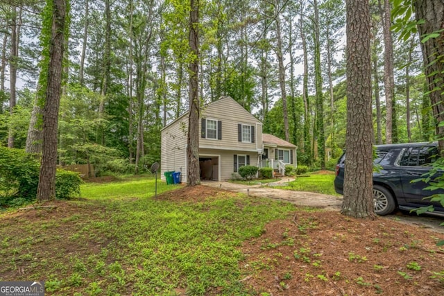 447 Sherwood Cir, Stone Mountain, GA 30087 - tri-level home featuring concrete driveway and a front lawn