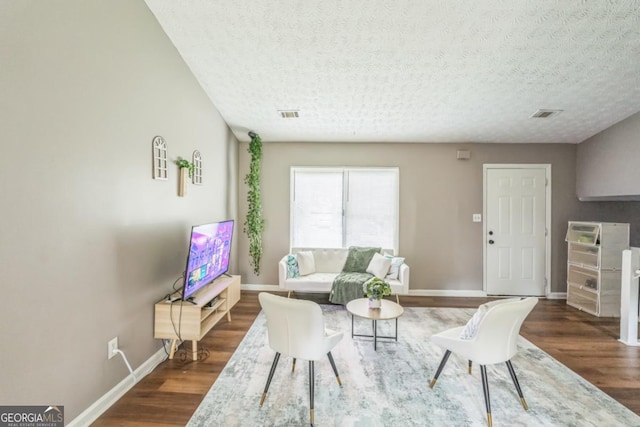 447 Sherwood Cir, Stone Mountain, GA 30087 - living room with wood finished floors and a textured ceiling