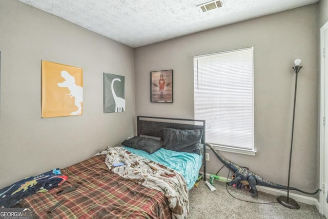 447 Sherwood Cir, Stone Mountain, GA 30087 - bedroom featuring carpet floors and a textured ceiling