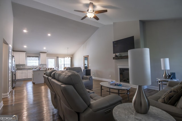 11 Rachel Ln, Hartwell, GA 30643 - living area featuring ceiling fan, a glass covered fireplace, wood finished floors, recessed lighting, and high vaulted ceiling