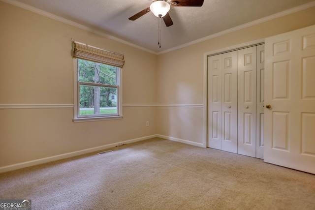120 Fox Hunt Pl, Athens, GA 30606 - unfurnished bedroom with carpet, crown molding, a closet, and a ceiling fan