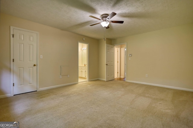 120 Fox Hunt Pl, Athens, GA 30606 - unfurnished bedroom with a textured ceiling, light carpet, ensuite bath, and a ceiling fan