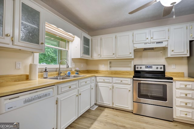 120 Fox Hunt Pl, Athens, GA 30606 - kitchen with white dishwasher, stainless steel electric range, under cabinet range hood, and light countertops
