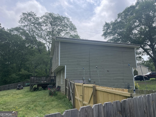 1791 Little Fawn Trl NW, Conyers, GA 30012 - view of home's exterior featuring a fenced backyard and a deck