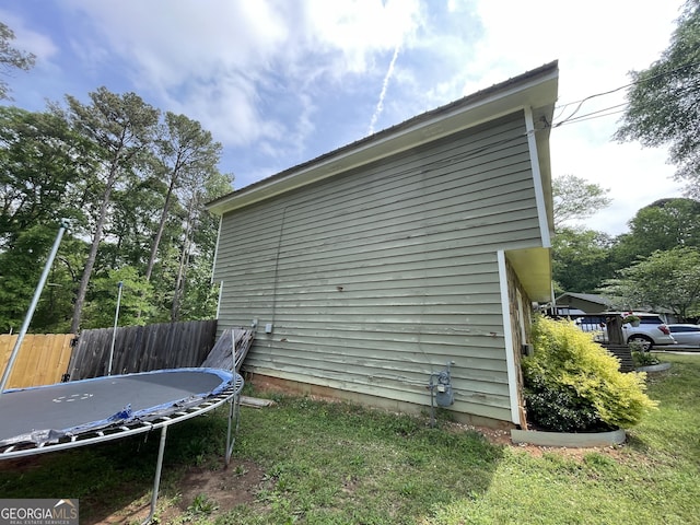 1791 Little Fawn Trl NW, Conyers, GA 30012 - view of home's exterior with a trampoline