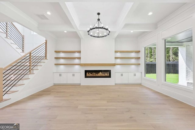 3205 Bold Springs Rd, Dacula, GA 30019 - unfurnished living room featuring a chandelier, beam ceiling, light wood-style floors, stairway, and ornamental molding