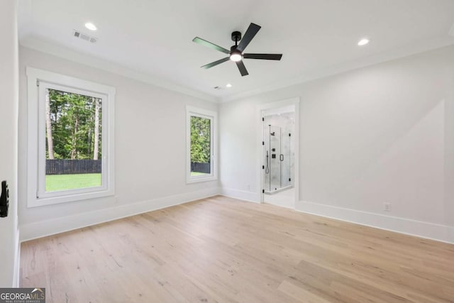 3205 Bold Springs Rd, Dacula, GA 30019 - empty room featuring plenty of natural light, light wood finished floors, ceiling fan, recessed lighting, and crown molding