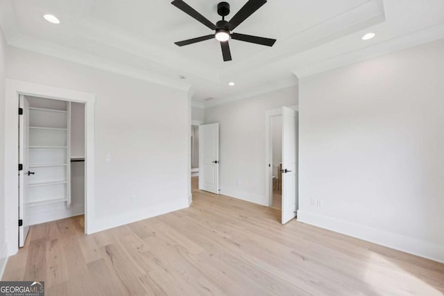 3205 Bold Springs Rd, Dacula, GA 30019 - empty room with ceiling fan, a raised ceiling, light wood-style flooring, and recessed lighting