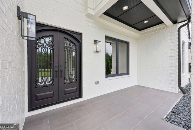 3205 Bold Springs Rd, Dacula, GA 30019 - property entrance with french doors and brick siding