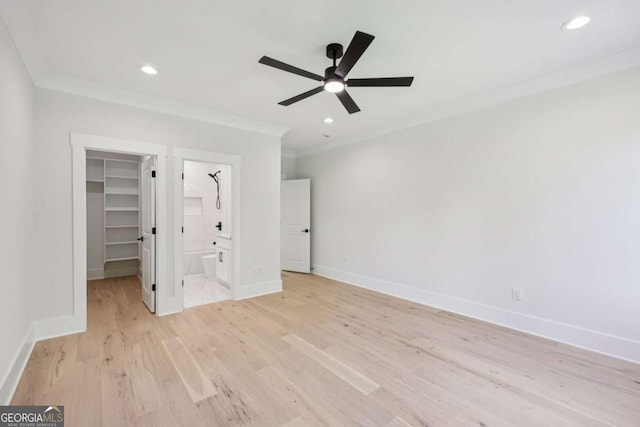 3205 Bold Springs Rd, Dacula, GA 30019 - unfurnished bedroom featuring a spacious closet, ornamental molding, light wood-type flooring, recessed lighting, and a closet