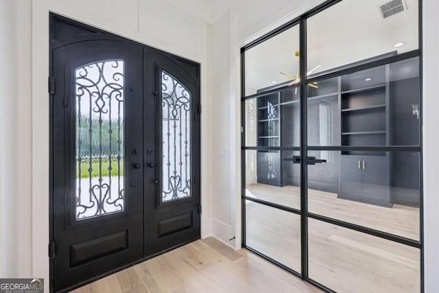 3205 Bold Springs Rd, Dacula, GA 30019 - entryway with french doors and wood finished floors