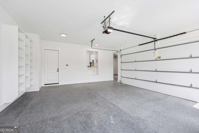 3205 Bold Springs Rd, Dacula, GA 30019 - garage with a garage door opener and recessed lighting