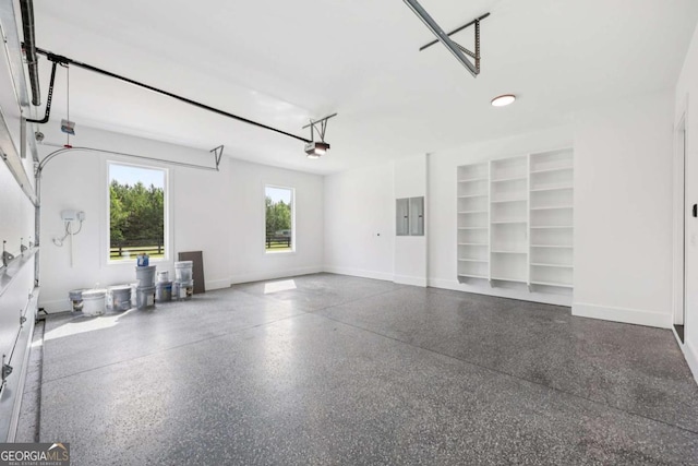 3205 Bold Springs Rd, Dacula, GA 30019 - garage featuring electric panel and a garage door opener