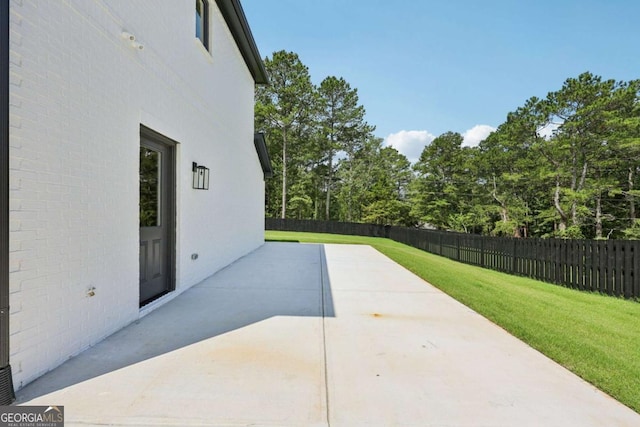 3205 Bold Springs Rd, Dacula, GA 30019 - fenced backyard with a patio area
