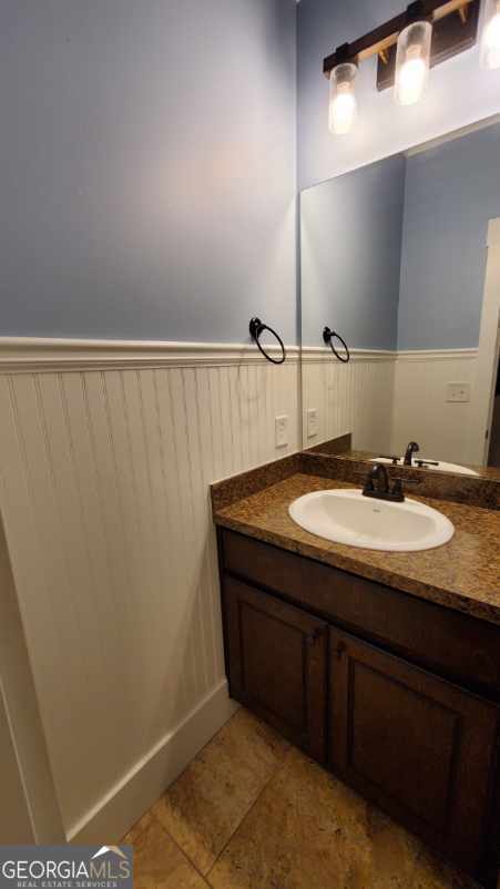 90 Alcovy Reserve Way, Covington, GA 30014 - bathroom featuring wainscoting, vanity, and tile patterned floors