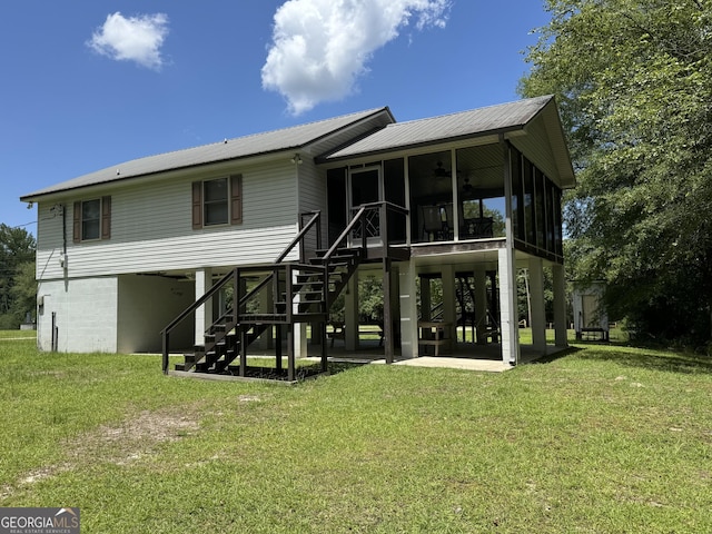 42 Lagoon Rd, Statesboro, GA 30461 - rear view of house with stairs, a sunroom, ceiling fan, and a yard