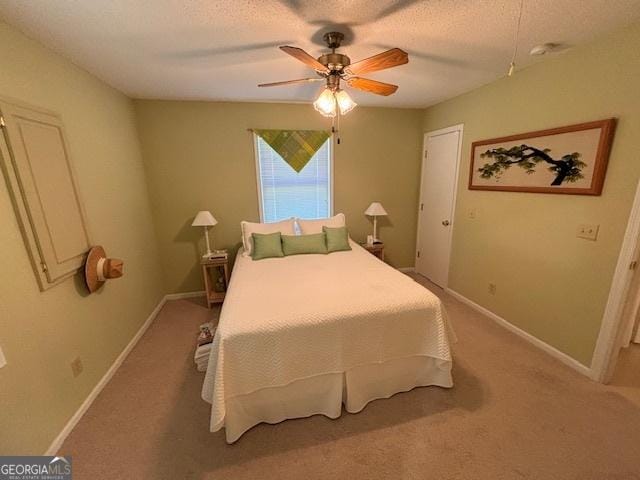 42 Lagoon Rd, Statesboro, GA 30461 - bedroom featuring light colored carpet, a textured ceiling, and ceiling fan