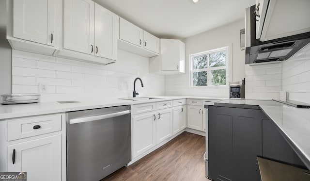 1 Lamar Ave SW, Atlanta, GA 30310 - kitchen with dishwasher, range with electric cooktop, white cabinets, and backsplash