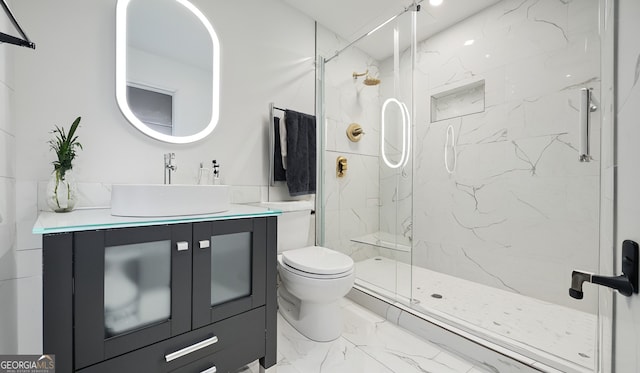 1 Lamar Ave SW, Atlanta, GA 30310 - bathroom featuring marble look tile flooring, vanity, and a marble finish shower