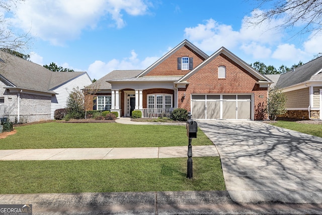 220 Begonia Ct, Griffin, GA 30223 - traditional home with brick siding, covered porch, driveway, a front lawn, and a garage