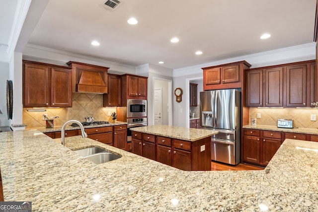 220 Begonia Ct, Griffin, GA 30223 - kitchen with stainless steel appliances, custom range hood, light stone counters, decorative backsplash, and ornamental molding