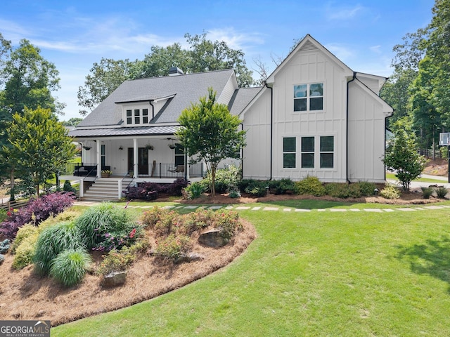 4813 Jess Helton Rd, Gainesville, GA 30506 - view of front facade featuring a front lawn, board and batten siding, and covered porch