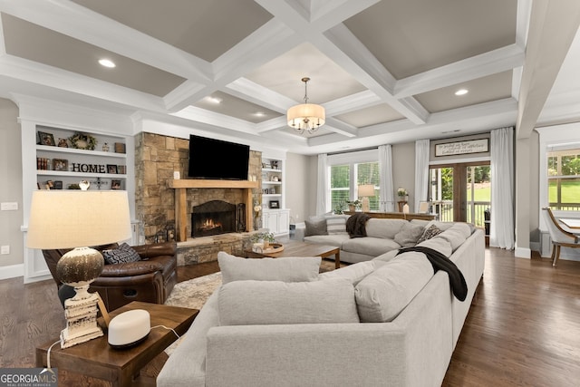 4813 Jess Helton Rd, Gainesville, GA 30506 - living area featuring healthy amount of natural light, dark wood finished floors, a stone fireplace, a chandelier, and beam ceiling