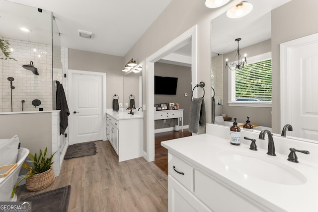 4813 Jess Helton Rd, Gainesville, GA 30506 - full bath with a stall shower, wood finished floors, two vanities, and a chandelier