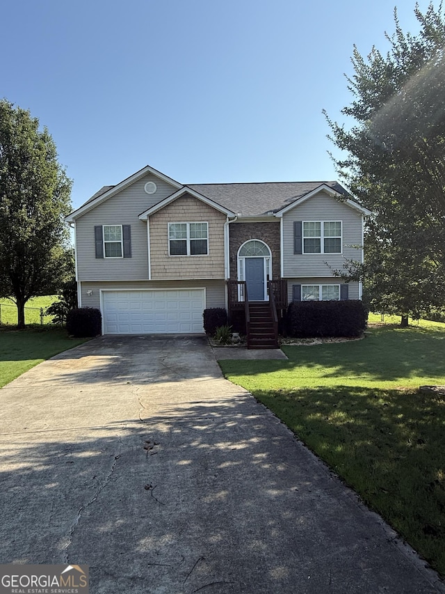 330 Anchors Way, Winder, GA 30680 - split foyer home with driveway, an attached garage, and a front yard
