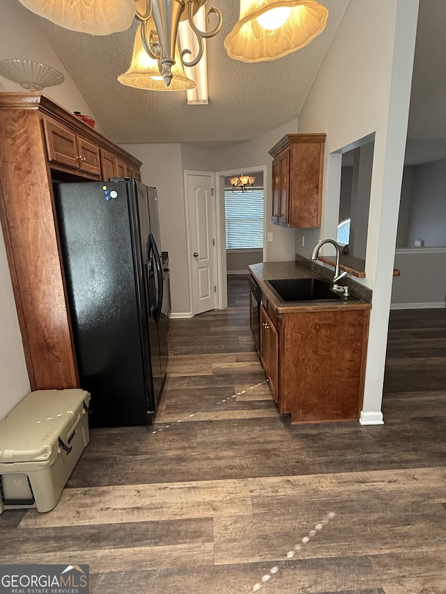 330 Anchors Way, Winder, GA 30680 - kitchen featuring black appliances, a chandelier, a textured ceiling, dark wood finished floors, and dark countertops