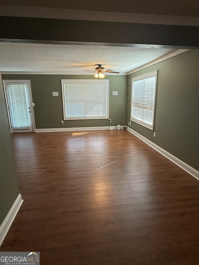 330 Anchors Way, Winder, GA 30680 - spare room featuring a textured ceiling, dark wood finished floors, a ceiling fan, and ornamental molding