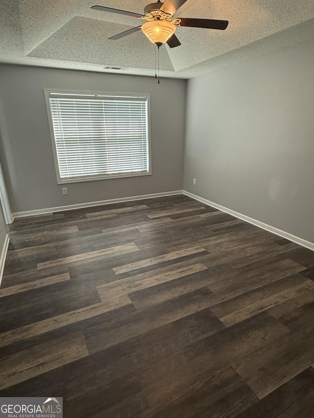 330 Anchors Way, Winder, GA 30680 - empty room with a textured ceiling, a ceiling fan, and dark wood-type flooring