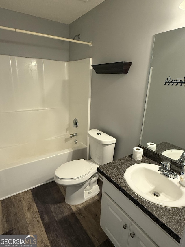330 Anchors Way, Winder, GA 30680 - bathroom featuring wood finished floors, bathtub / shower combination, and vanity