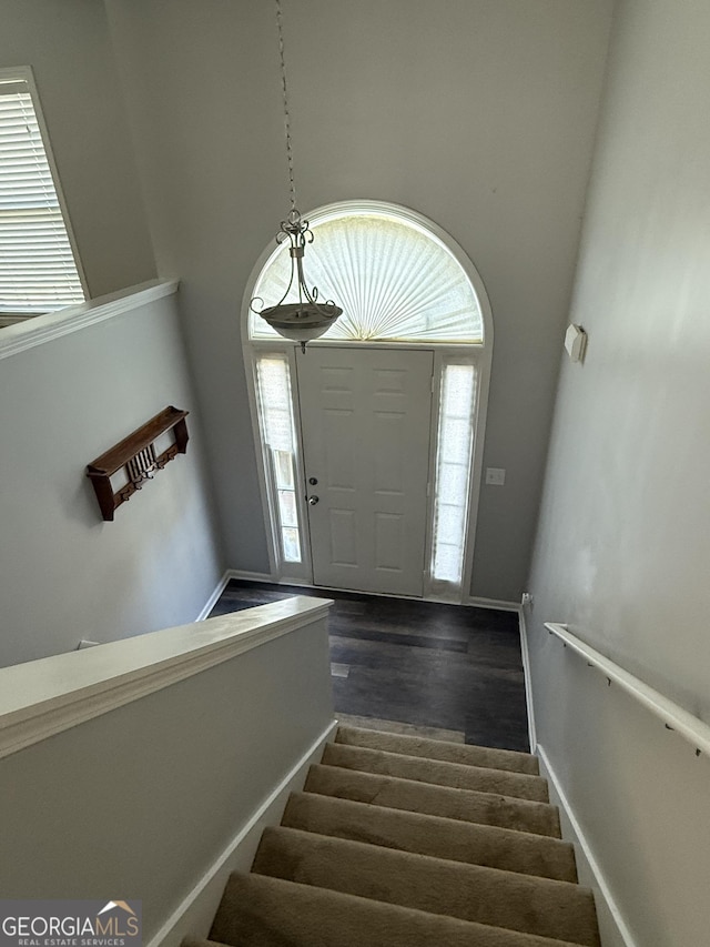330 Anchors Way, Winder, GA 30680 - foyer entrance featuring stairs, plenty of natural light, and dark wood-type flooring