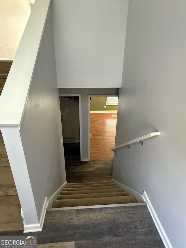 330 Anchors Way, Winder, GA 30680 - stairs featuring wood finished floors and a high ceiling