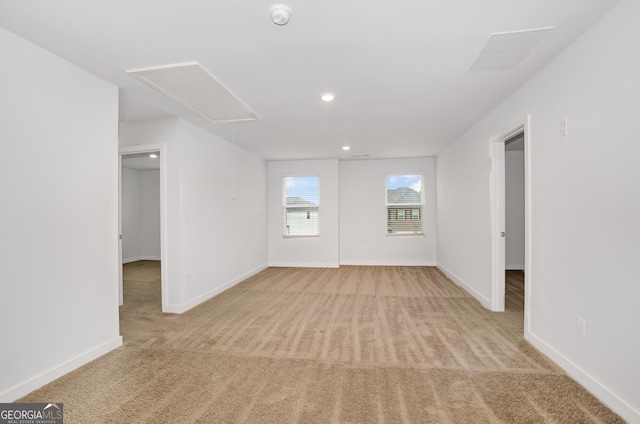 1184 Bluecoat Cir Unit 84, Hampton, GA 30228 - spare room with attic access, light carpet, a smoke detector, and recessed lighting