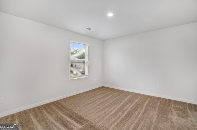 1184 Bluecoat Cir Unit 84, Hampton, GA 30228 - carpeted empty room with baseboards and recessed lighting
