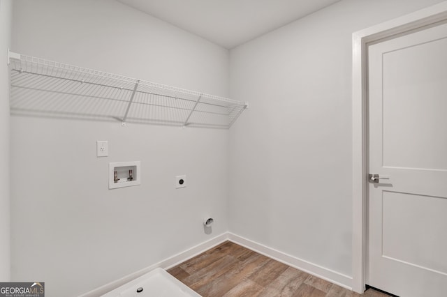 1184 Bluecoat Cir Unit 84, Hampton, GA 30228 - laundry area with hookup for an electric dryer, light wood-style flooring, and hookup for a washing machine