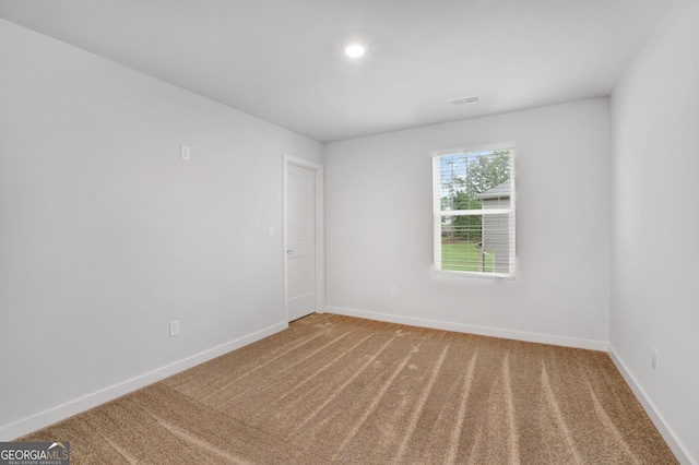 1184 Bluecoat Cir Unit 84, Hampton, GA 30228 - carpeted empty room featuring baseboards and recessed lighting
