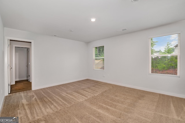 1184 Bluecoat Cir Unit 84, Hampton, GA 30228 - empty room featuring carpet flooring, plenty of natural light, and recessed lighting