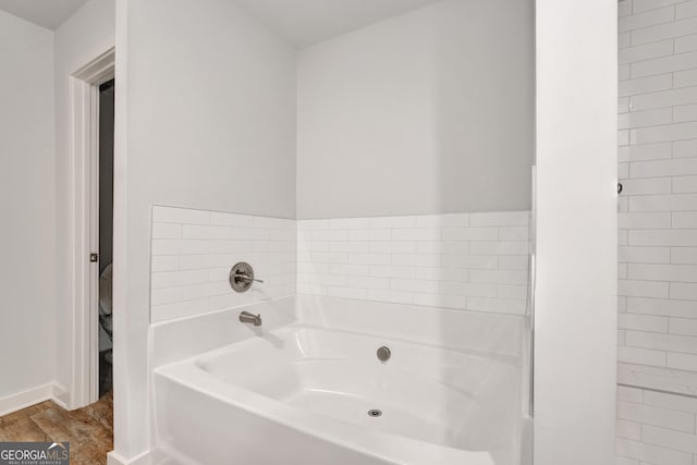1184 Bluecoat Cir Unit 84, Hampton, GA 30228 - full bathroom with a garden tub and wood finished floors