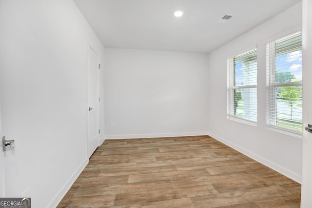 1184 Bluecoat Cir Unit 84, Hampton, GA 30228 - unfurnished room with light wood-style flooring and recessed lighting
